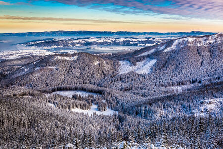 Sunrise over the mountain valley in winter