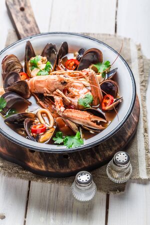Spicy seafood soup with mussels and shrimpsの写真素材