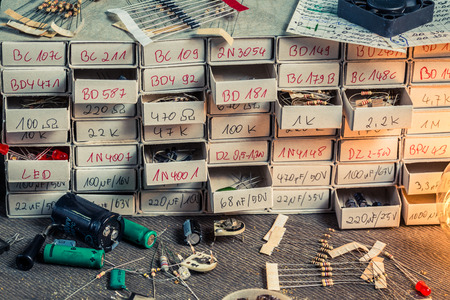 Old electronics parts on work desk in physics lab