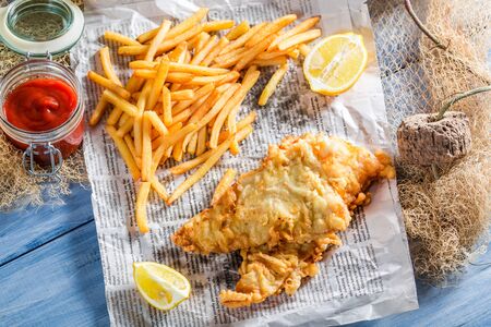 Hot fish cod with chips in newspaperの写真素材