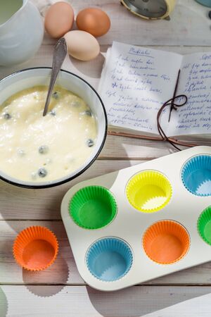 Baking delicious cupcakes with berry fruits