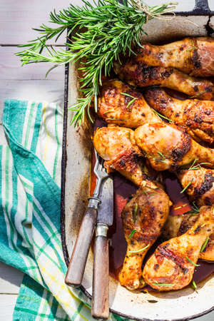 Roasted chicken legs in summer kitchenの写真素材