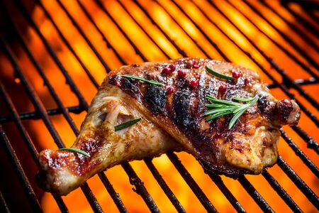 Roasted chicken leg with rosemaryの写真素材