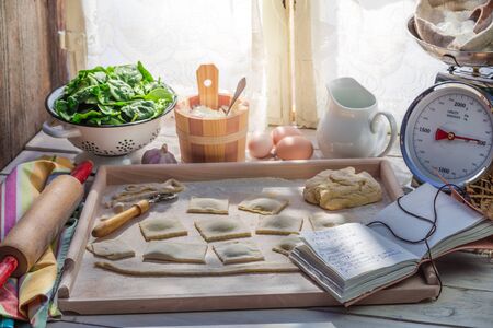 Homemade ravioli in the sunny kitchenの写真素材