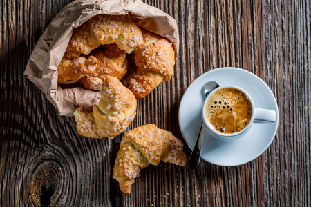 Delicious croissant and coffee for breakfastの写真素材