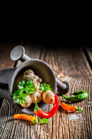 Various spices and herbs in mortarの写真素材