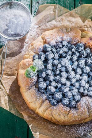 Fresh blueberry pie in sunny dayの写真素材