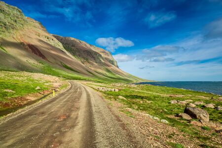 Mountain road near the Arctic sea in Icelandの写真素材