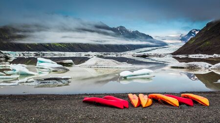 Kayaking on a cold lake near a glacier in Iceland