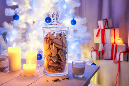 Snacking gingerbread cookies with milk for Christmas Eveの写真素材