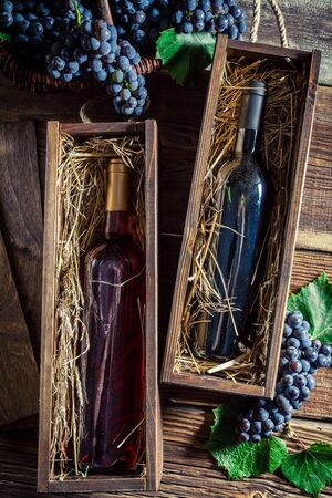 Fresh red wine in old wooden boxの写真素材