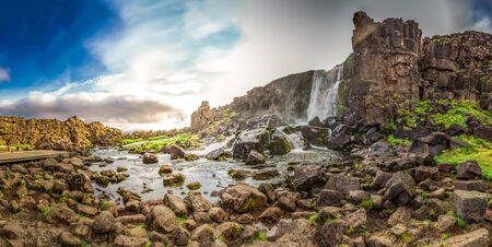 Panorama of waterfall in mountains in Icelandの写真素材