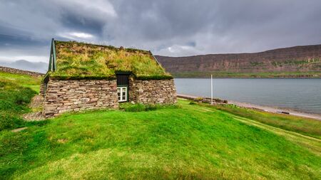 Cottage covered with grass on the roof in Iceland
