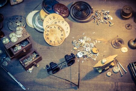 Vintage watchmaker's workshop full of clocksの写真素材
