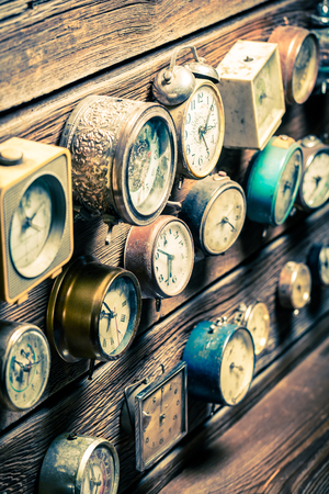 Old wooden wall with clocksの写真素材