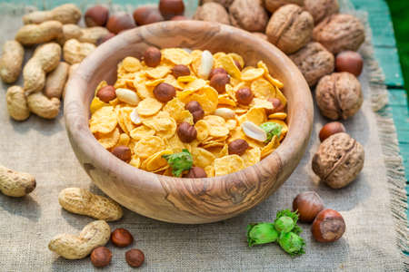 Healthy cornflakes with milk and nutsの写真素材