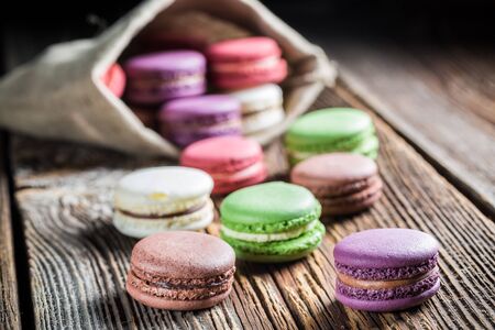 Fresh macaroons on wooden tableの写真素材