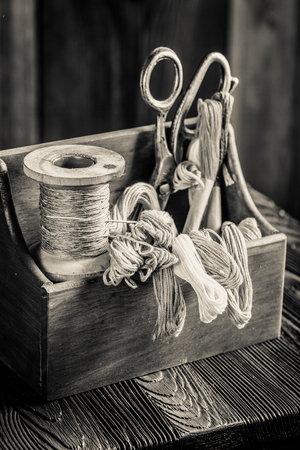 Needle, threads and scissors in tailor workshopの写真素材