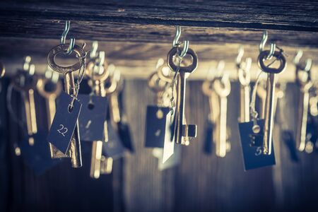 Aged hotel with keys for roomsの写真素材