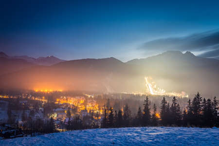 Skiing competitions in Zakopane in winter at dusk, Polandの写真素材