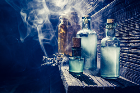 Magical witch lab with blue light and potion for Halloweenの写真素材