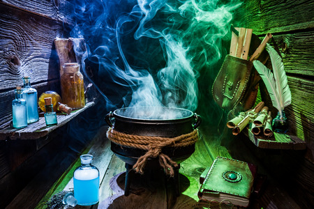 Vintage witch pot with blue and green smoke for Halloweenの写真素材