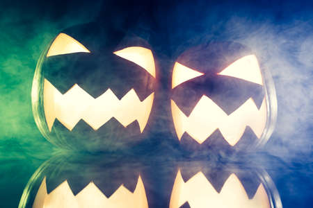Glowing pumpkins and smoke on Halloweenの写真素材