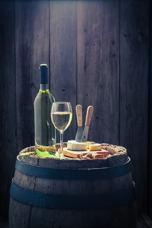 White wine with camembert cheese to snackの写真素材