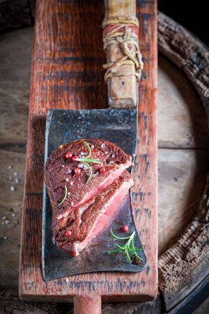 Delicious steak with rosemary, salt and pepperの写真素材