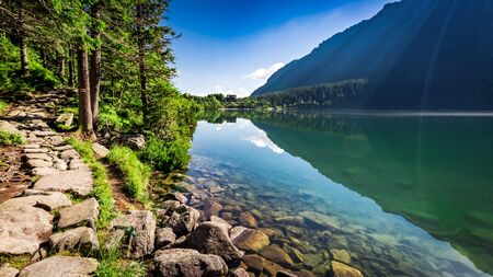 Wonderful dusk at pond in the Tatra Mountains in summerの写真素材