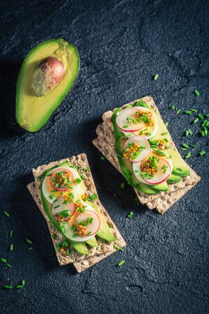 Fresh sandwich with avocado, chive and eggsの写真素材