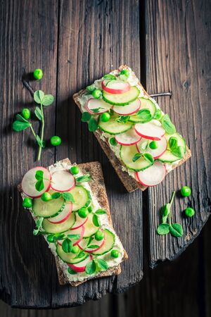 Fresh sandwich with avocado, creamy cheese and peasの写真素材