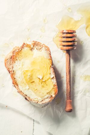 Healthy sandwich with honey and wholegrain breadの写真素材