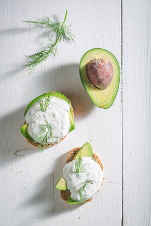 Healthy sandwich with avocado, dill and tzatziki sauceの写真素材