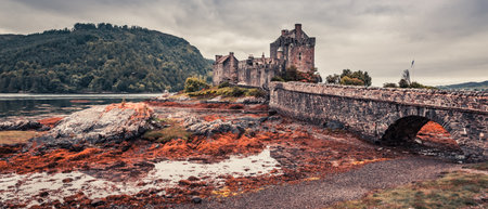 Sunset over lake at Eilean Donan Castle in Scotlandのeditorial素材