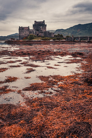 Breathtaking sunset over lake at Eilean Donan Castle in Scotlandのeditorial素材