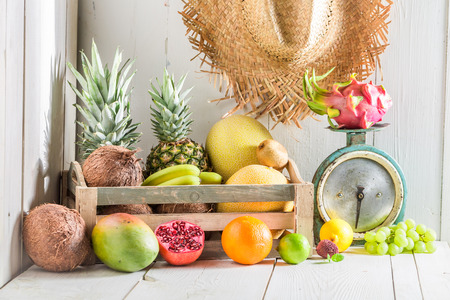 Fresh tropical fruits on a white tableの写真素材