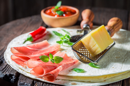 Enjoy your tortilla as quesadilla with cheese and hamの写真素材