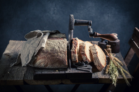 Fresh loaf of bread in dark room