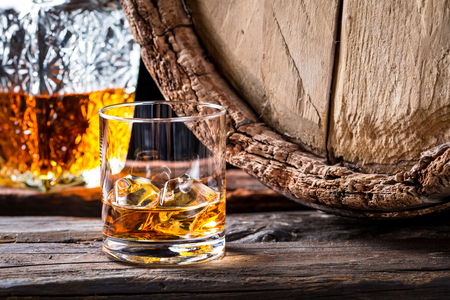 Closeup of glass of good cognac in the distillery basementの写真素材