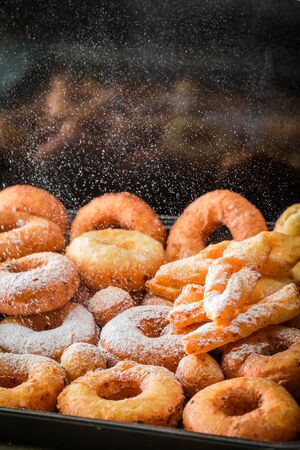 Homemade and delicious golden donuts freshly bakedの写真素材