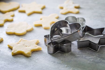Cutting from fresh dough delicious milky biscuits