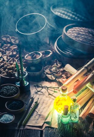 Old scrolls and recipe in magical research labの写真素材