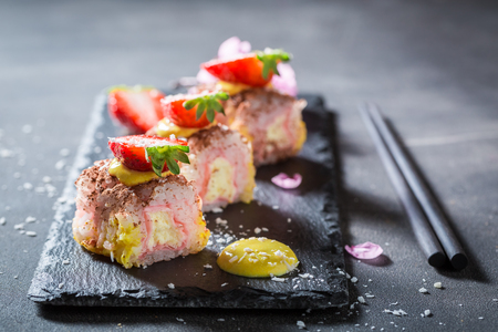 Closeup of sweet sushi made of strawberry and mangoの写真素材