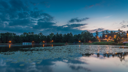 Calm lake with dynamic sky in summerの写真素材