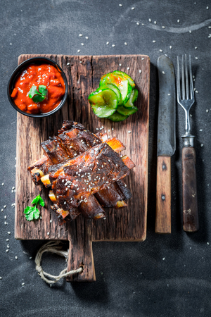 Tasty roasted ribs with potato and sesameの写真素材