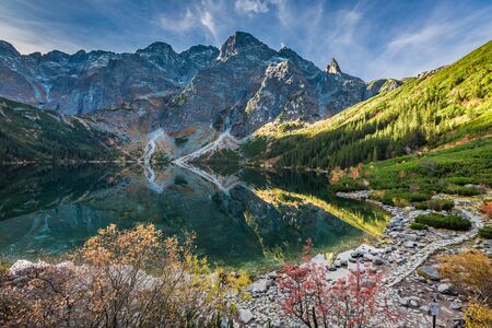 Cold sunrise at lake in the Tatra Mountains in autumnの写真素材