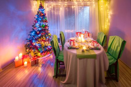 Christmas table setting during the frosty winter eveningの写真素材