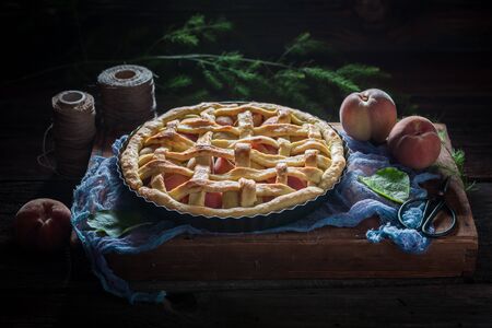 Rustic and sweet peaches pie made of fresh ingredientsの写真素材