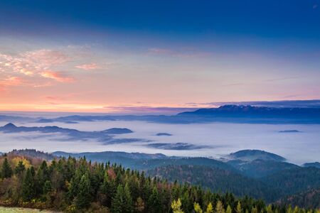 Stunning view to Tatras at sunrise with clouds in autumnの写真素材